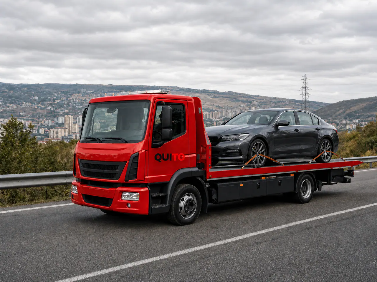 Quito-branded red European low-deck flatbed transporting a premium sedan near Tbilisi, Georgia